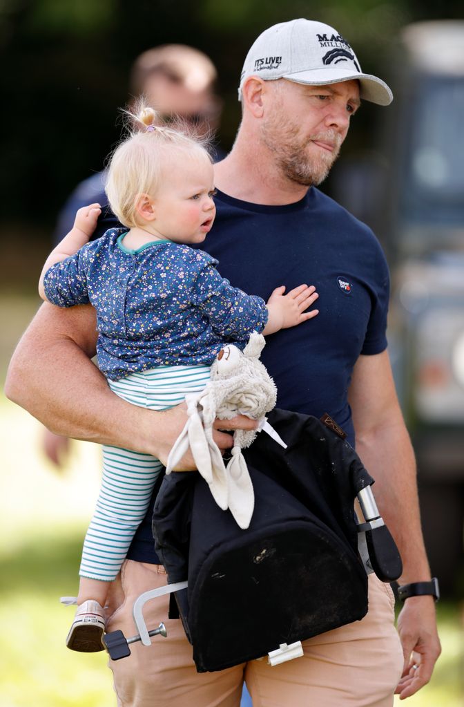 Mike Tindall carries daughter Lena Tindall