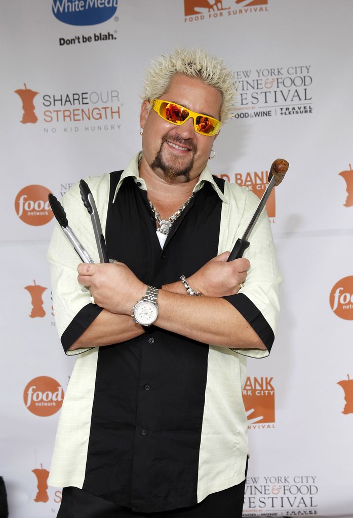 Chef and TV personality Guy Fieri poses at Guy Fieri's Live Grill-Off during the 2009 Food Network NYC Wine & Food Festival at the Norwegian Cruise Line Welcome Center at Pier 54 on October 9, 2009 in New York City.