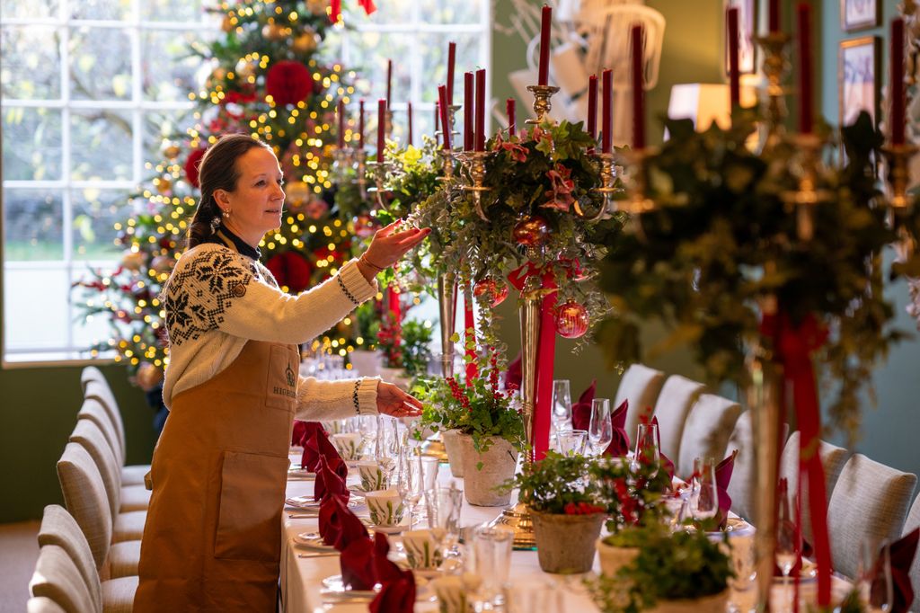 Staff at Highgrove Gardens prepare place settings in the Garden Room 