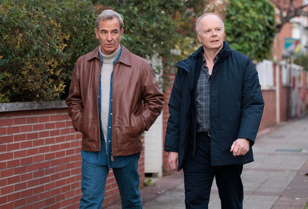 two men walking down street