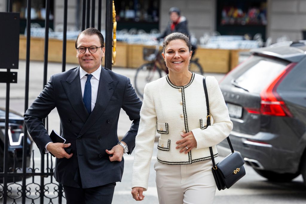 Crown princess victoria in cropped jacket with the black piping with husband Daniel