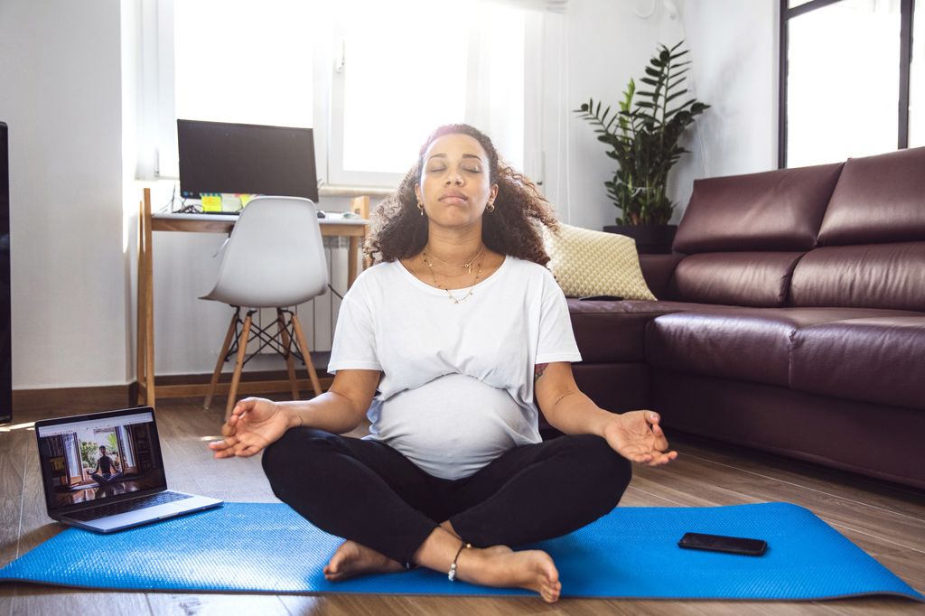 Pregnant woman practicing Yoga