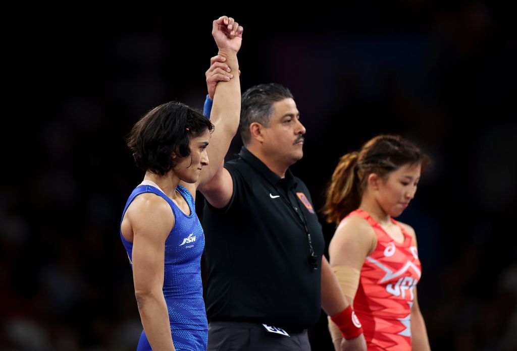 Yui Susaki of Team Japan and Vinesh Vinesh of Team India react during the Women's Freestyle 68kg Repechage match between Yui Susaki of Team Japan and Vinesh Vinesh of Team India on day eleven of the Olympic Games Paris 2024 at Champs-de-Mars Arena on August 06, 2024 in Paris, France