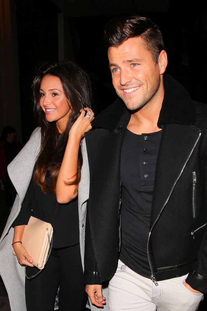 Michelle Keegan flashed her engagement ring in a black dress and grey jacket with Mark Wright in October 2013 