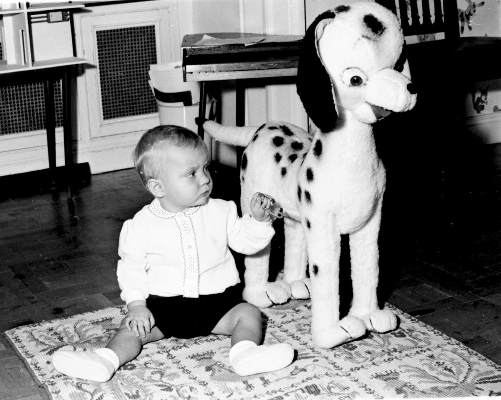 King Felipe as a baby playing with toys