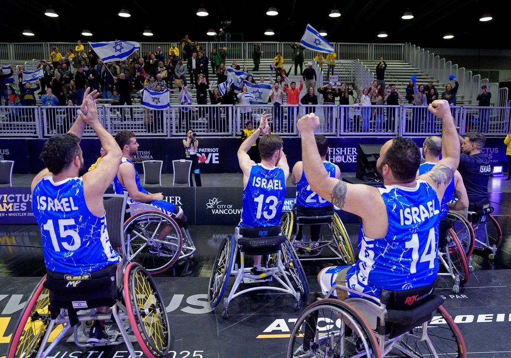 Members of Team Israel celebrate with fans after their gold medal wheelchair basketball match against the United States at the Invictus Games