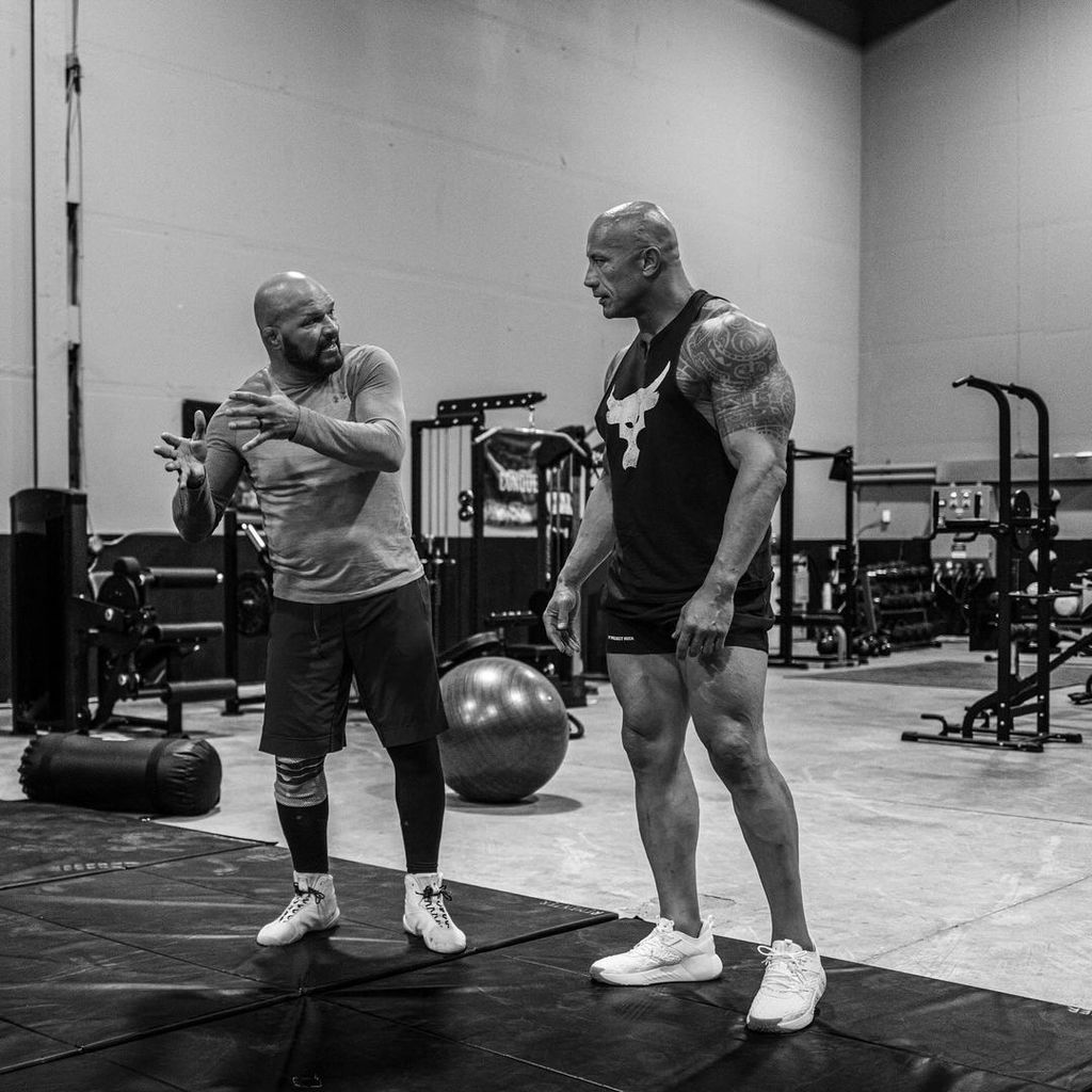 Dwayne Johnson and Mark Kerr at a training session