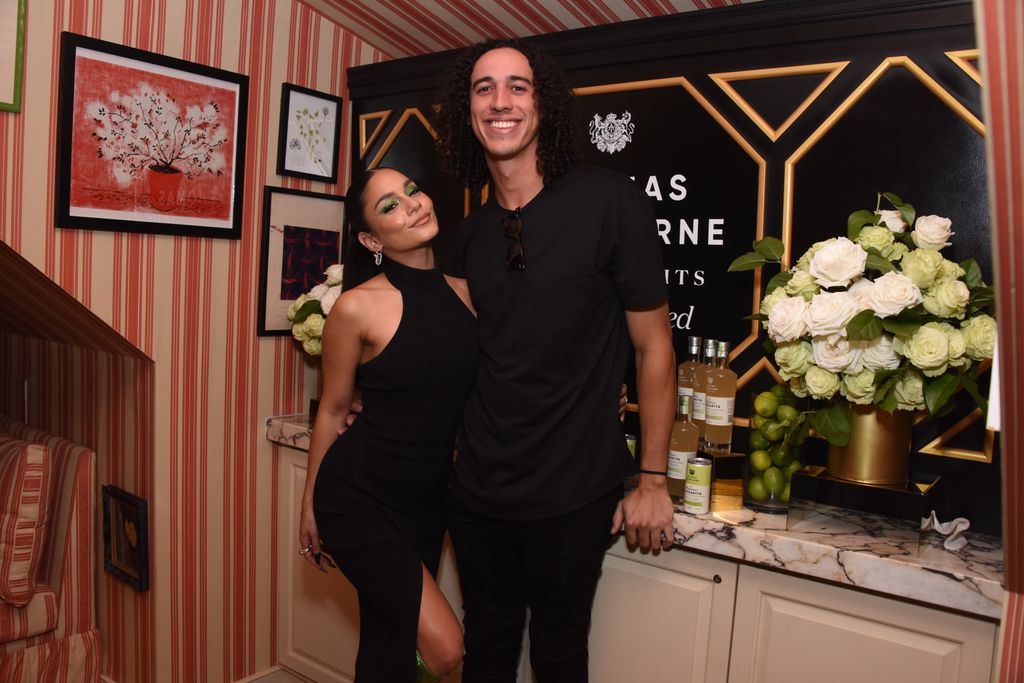 Vanessa in black dress and Cole in black outfit