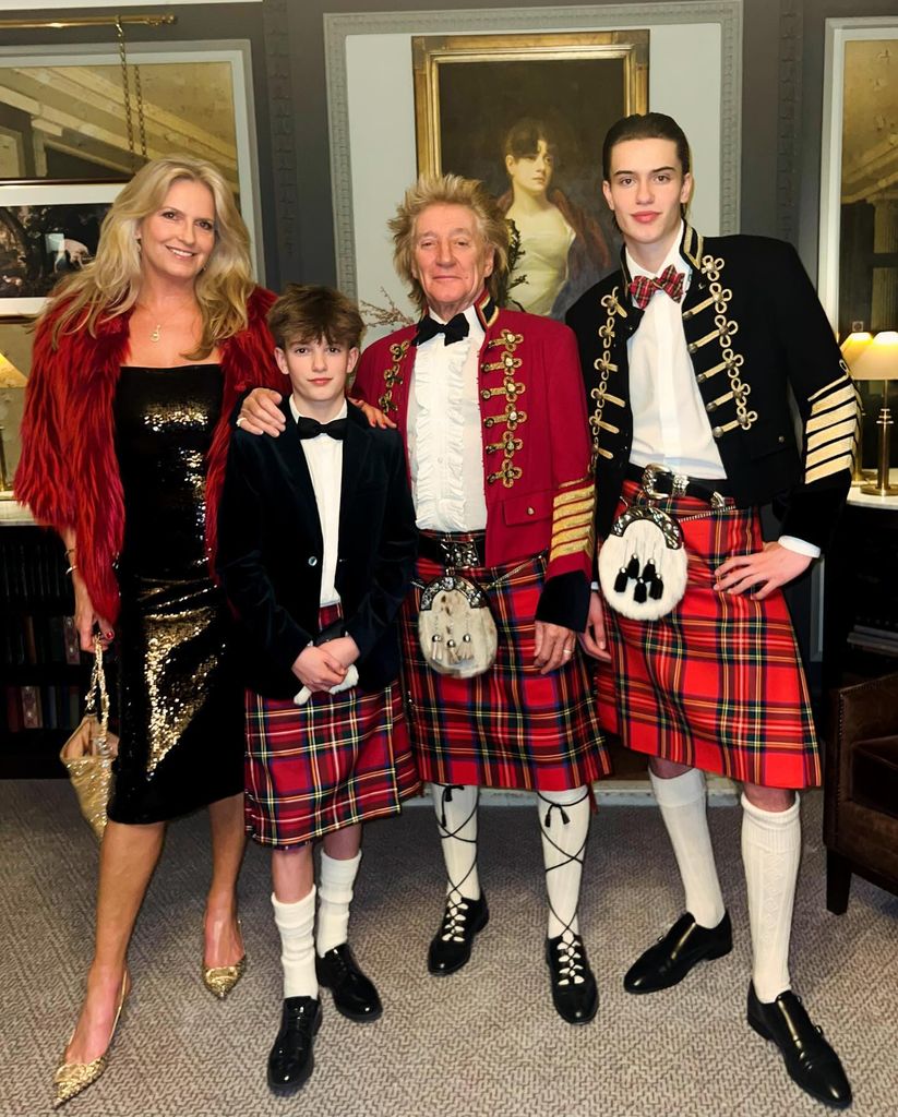 Alastair and Aiden Stewart wearing kilts, next to mum Penny Lancaster and dad Rod Stewart