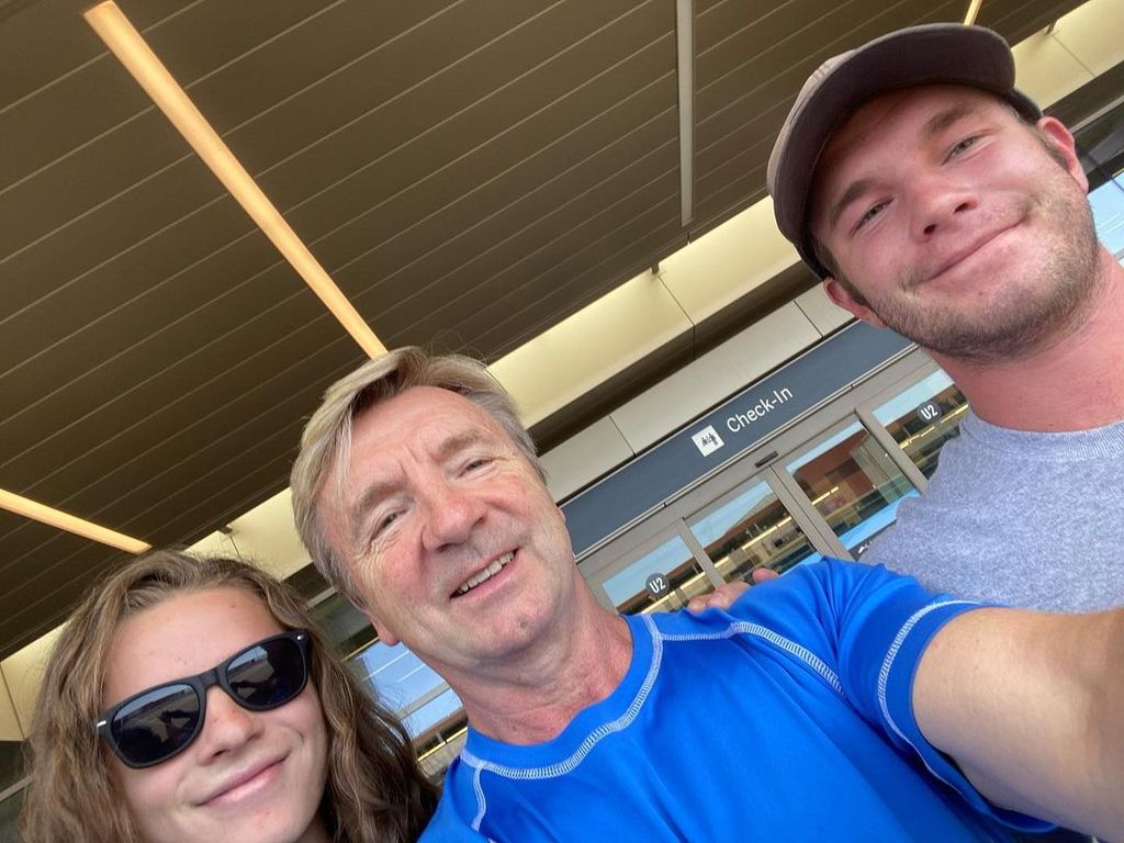 Christopher Dean takes a selfie with his two sons