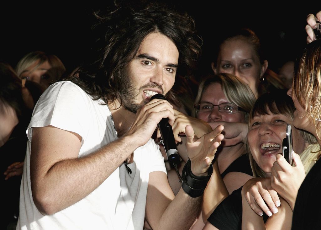 Russell Brand with a group of women