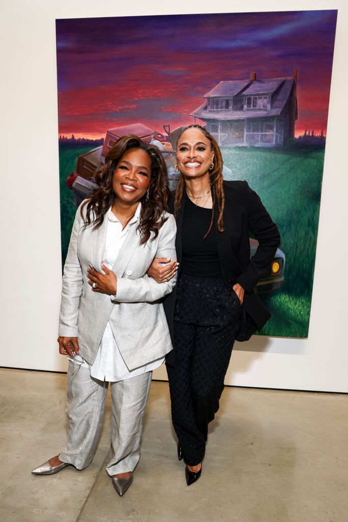 Oprah Winfrey and Ava DuVernay smile for camera