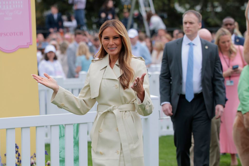 Melania Trump in a beige trench coat at Egg Roll