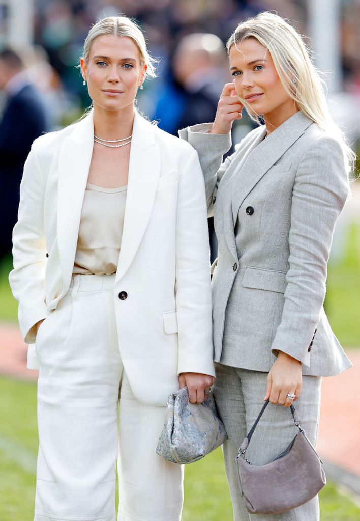 amelia in white suit, eliza in grey suit
