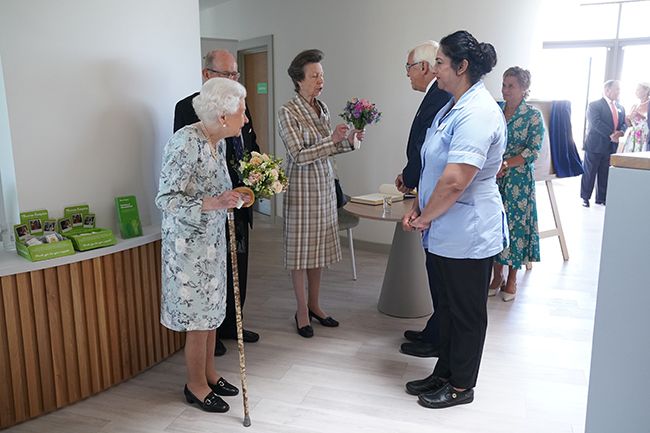 the queen holding posy