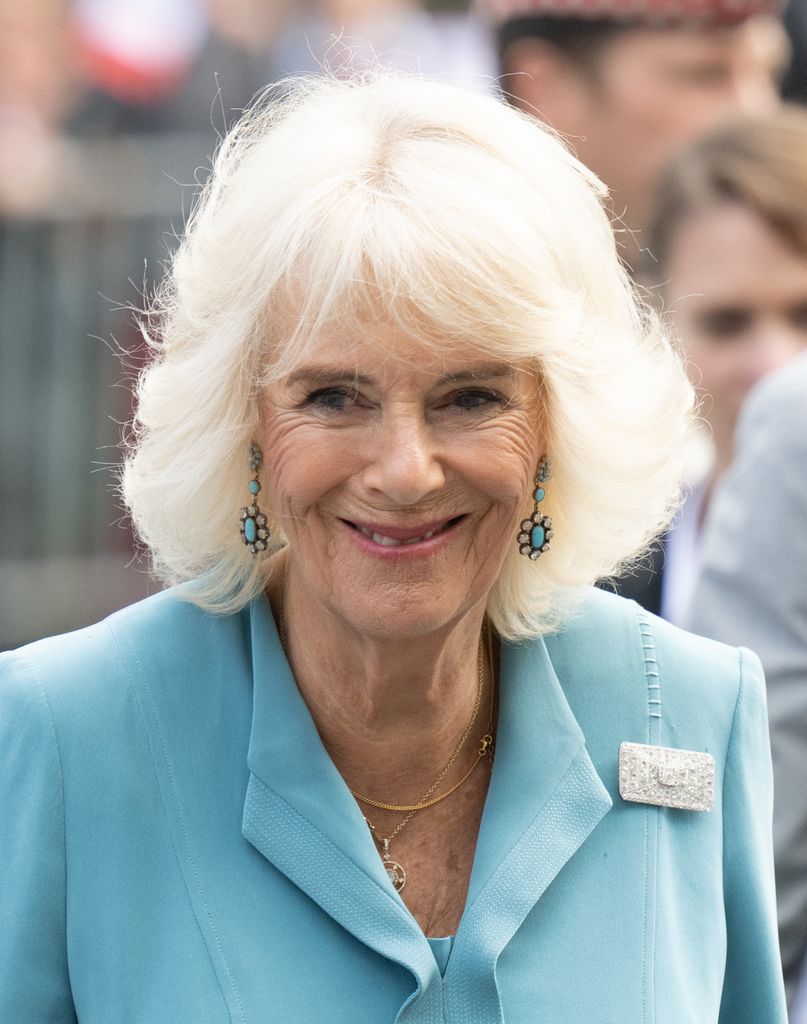 Queen Camilla in teal outfit
