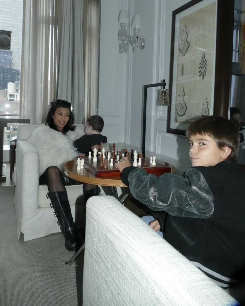 Kourtney, Rocky and Reign playing chess