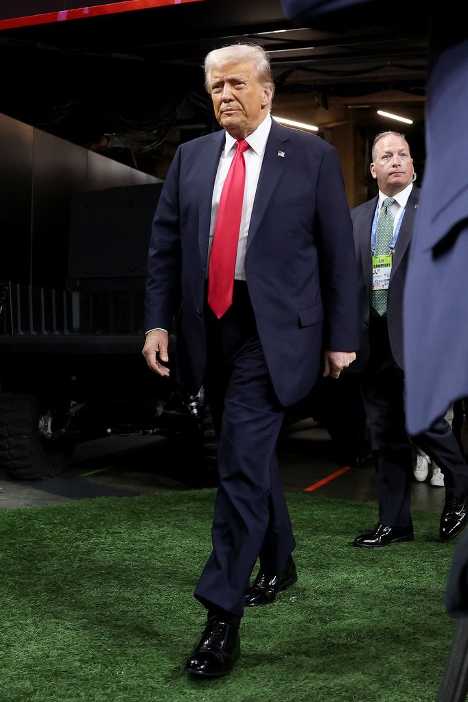 U.S. President Donald Trump walks onto the field prior to Super Bowl LIX between the Kansas City Chiefs and the Philadelphia Eagles at Caesars Superdome on February 09, 2025 in New Orleans, Louisiana.