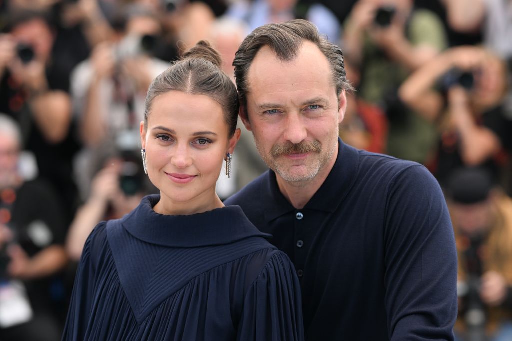 Alicia and Jude wore matching navy looks for the occasion