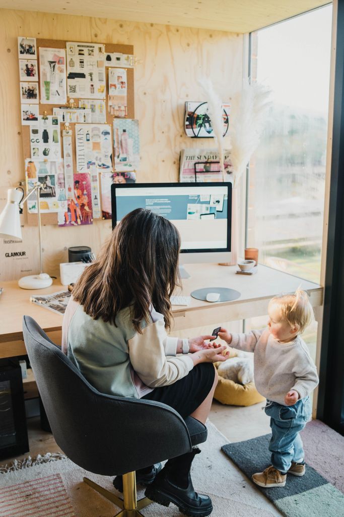 woman in her office with her daughter