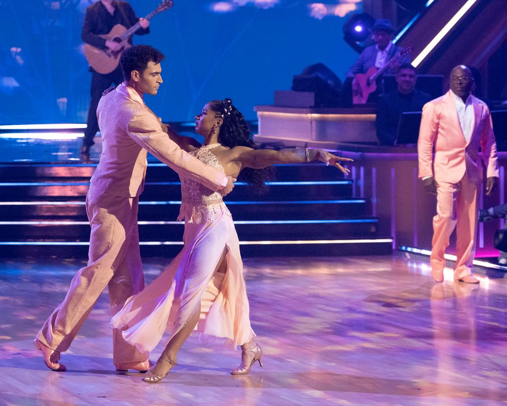 Jordan Chiles dances with her father, Timothy, and pro Ezra Sosa on DWTS