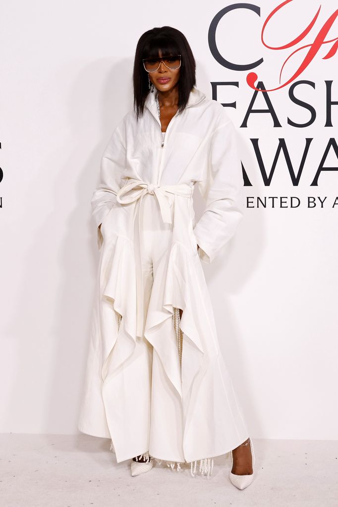 Naomi Campbell attends the 2025 CFDA Awards at American Museum of Natural History in a white coat