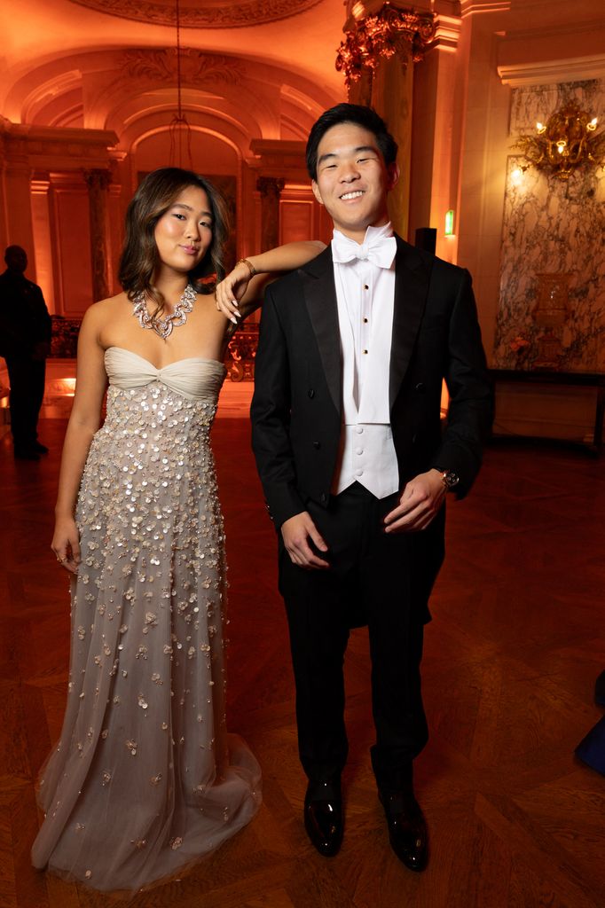 Sarah Bae and her twin brother in gown and white tie