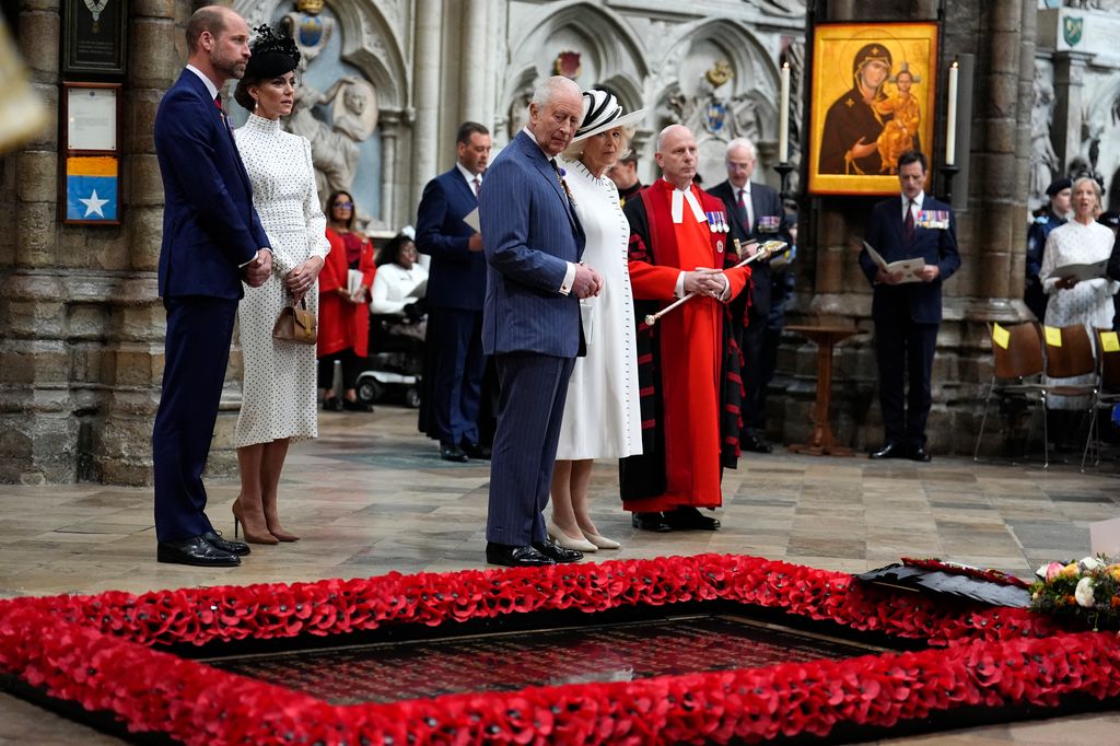 King Charles, Prince William, the Princess of Wales and Queen Camilla stand at the grave of the Unknown Warrior