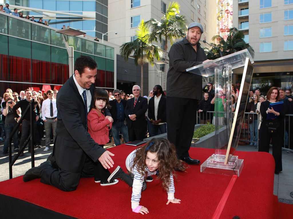 Sadie Sandler crawls around as Adam Sandler receives a star on the Hollywood Walk of Fame