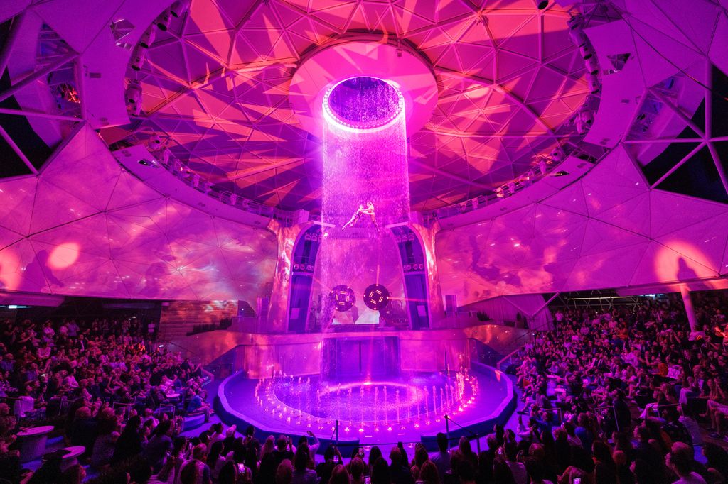 Perched at the top of Icon of the Seas is AquaDome, a tranquil oasis by day and a vibrant hot spot by night.