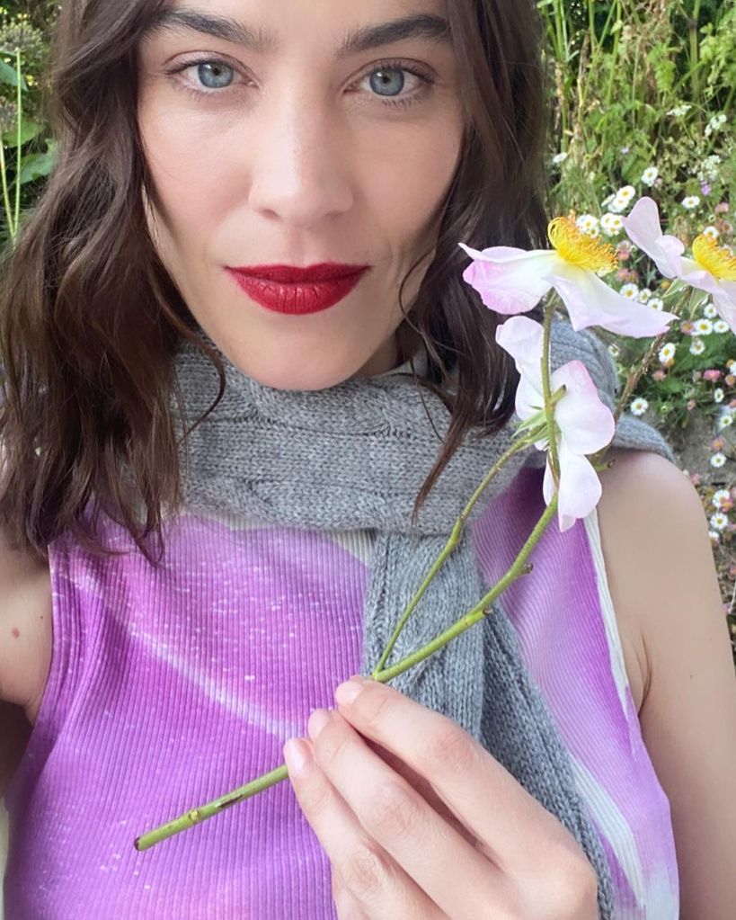 Alexa Chung opted for a super summery satin red lip