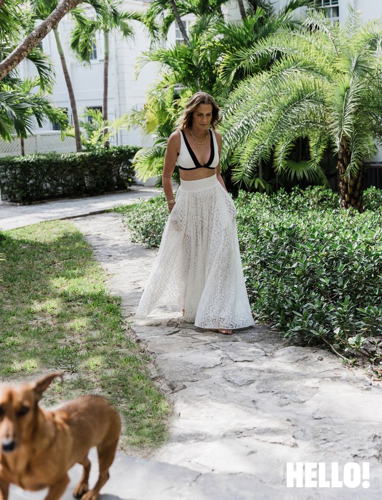 Woman in tropical setting with dog