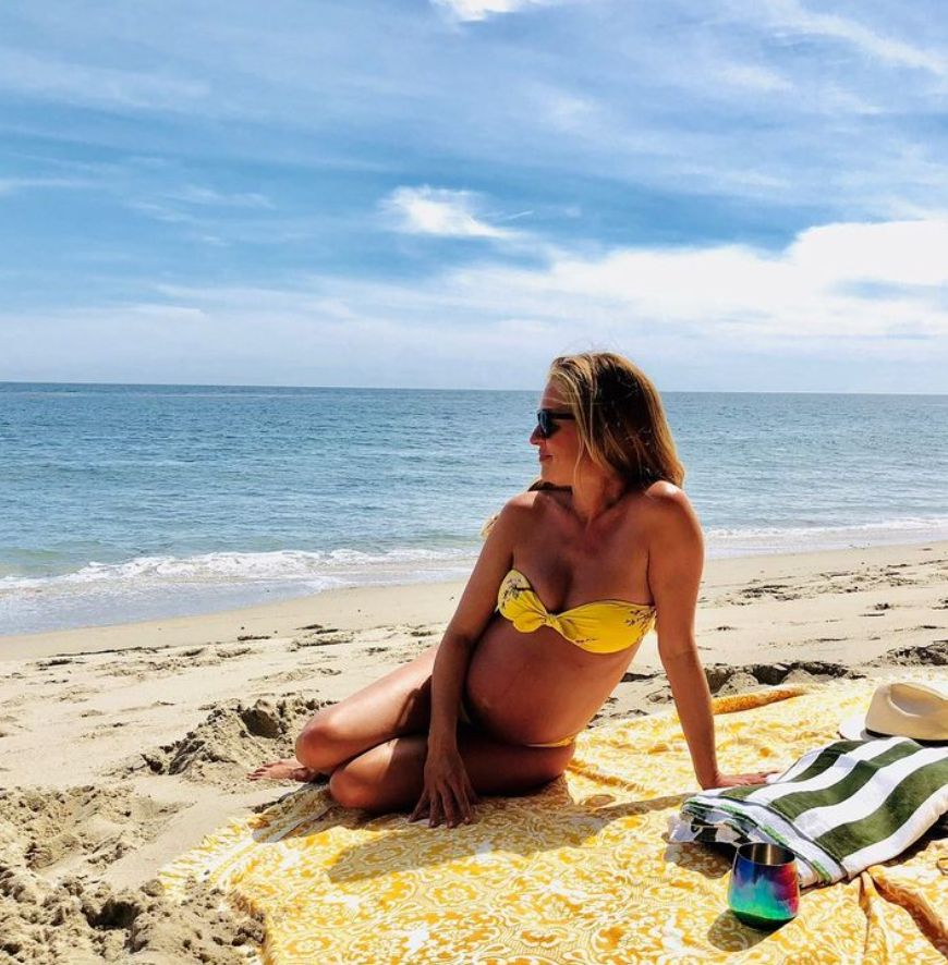 Cat Deeley on the beach in a yellow bikini