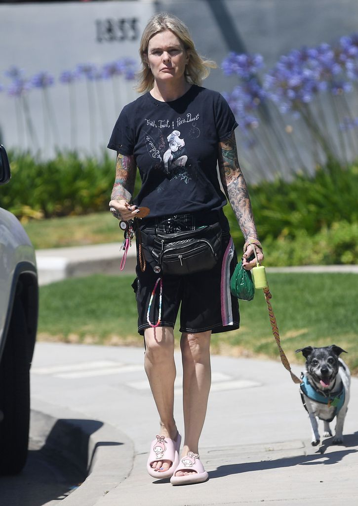 Erika Eleniak walking her dog 