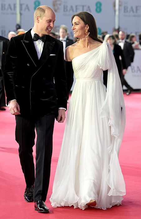 Prince William in a Tom Ford tuxedo walking the BAFTA red carpet alongside Princess Kate