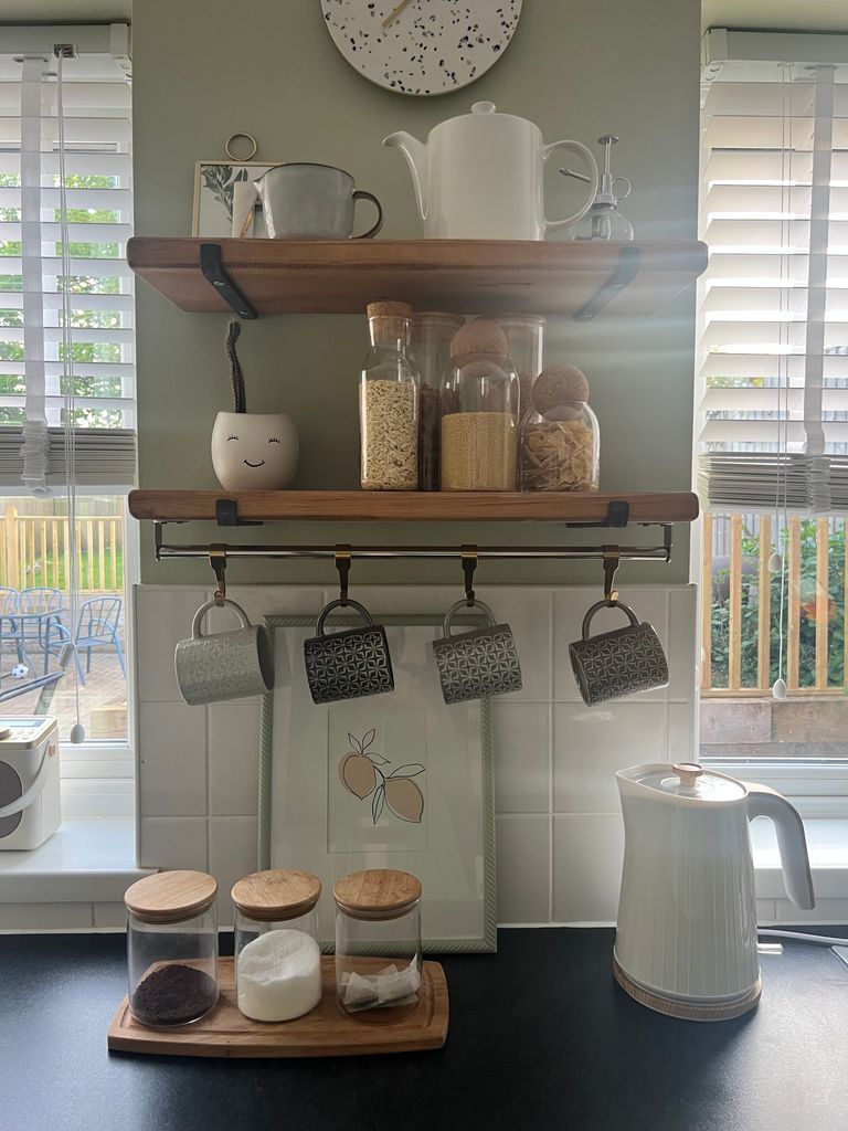 kitchen with shelves and kettle 
