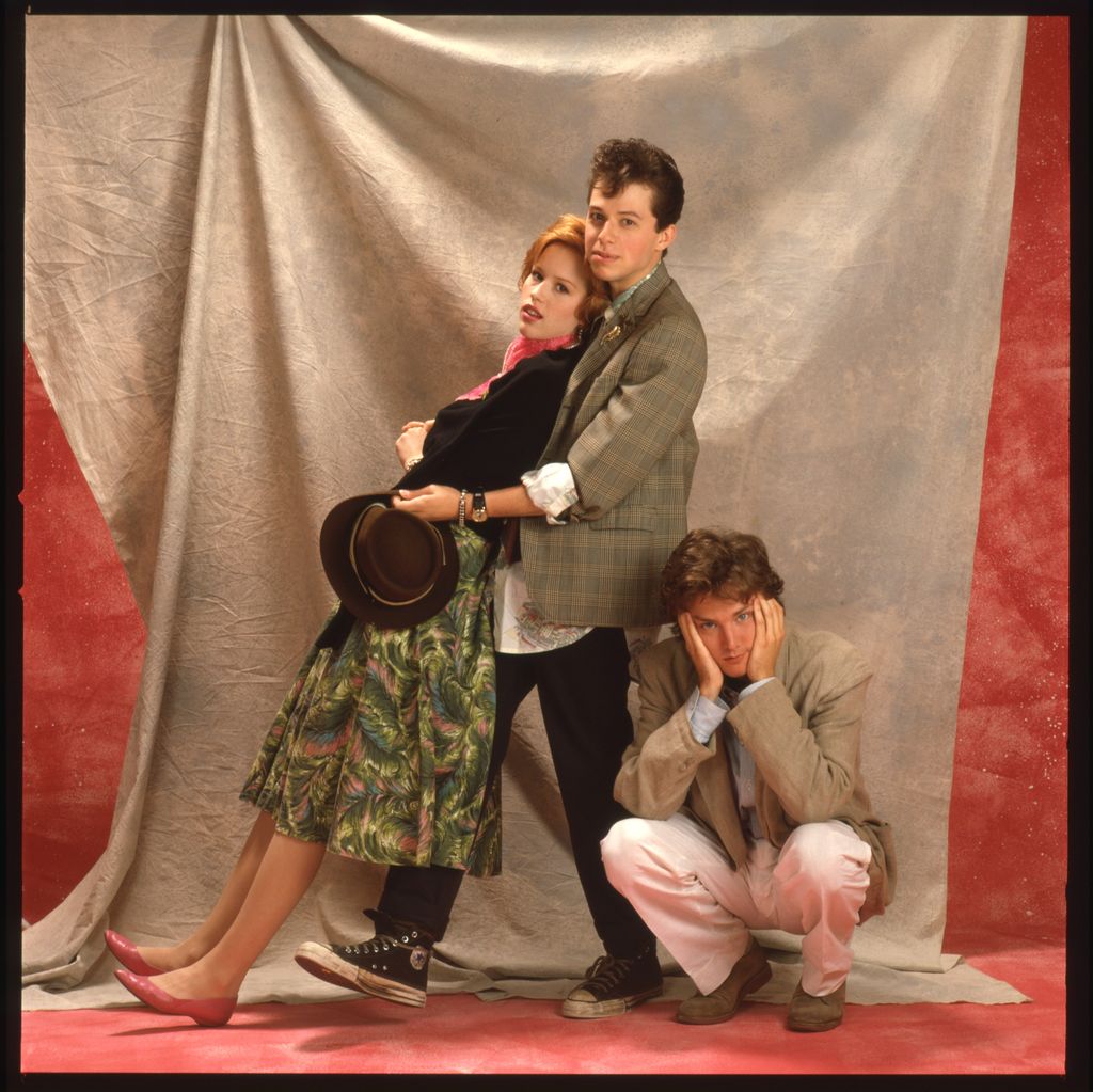 Molly Ringwald, Jon Cryer and Andrew McCarthy pose in costume on set for Pretty in Pink in 1986