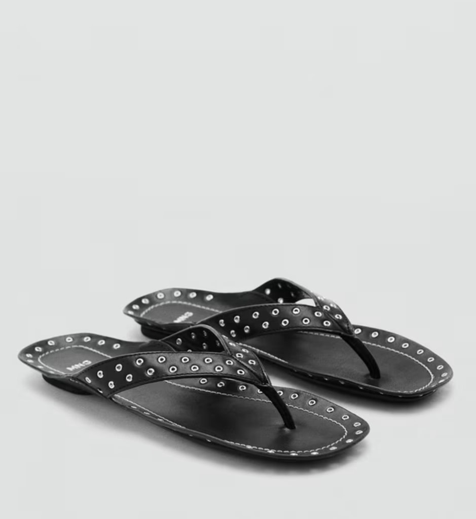 A pair of black studded flip flips from Mango