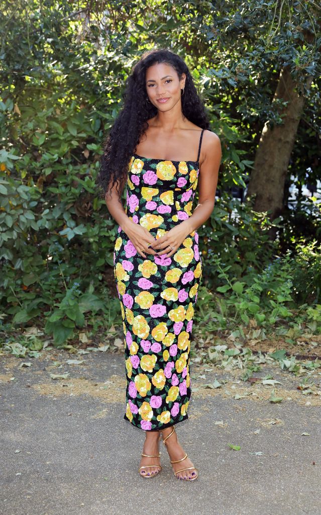 Vick Hope in a flower print dress