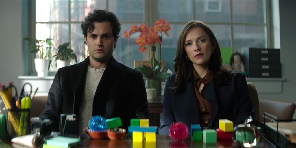 Man and woman sitting at desk