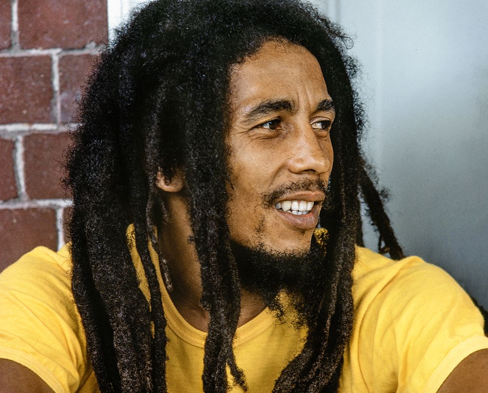 Bob Marley wearing a yellow T-shirt