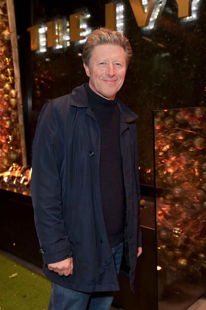 Charlie Stayt wearing a navy coat at an event at the Ivy 