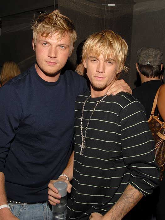 Nick and Aaron Carter pose for pictures