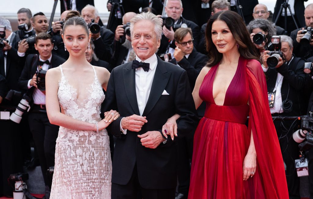 Carys Douglas arm in arm with Michael Douglas and Catherine Zeta-Jones in Cannes