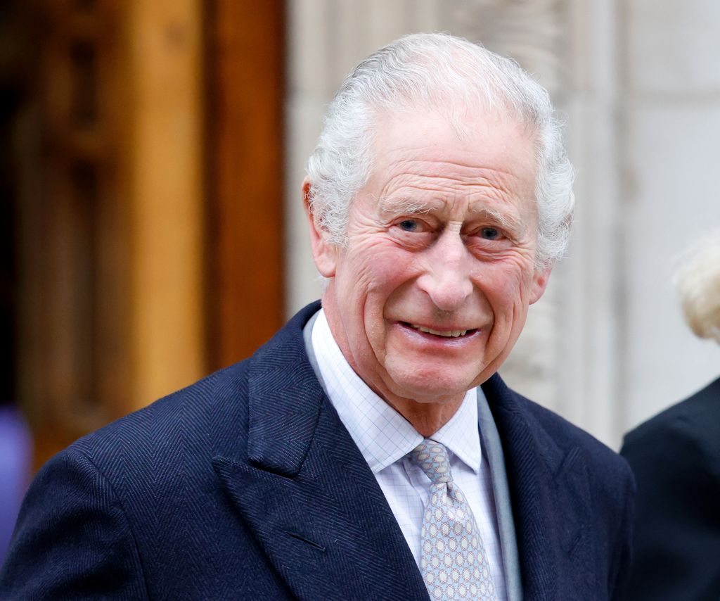 king charles smiling in navy suit