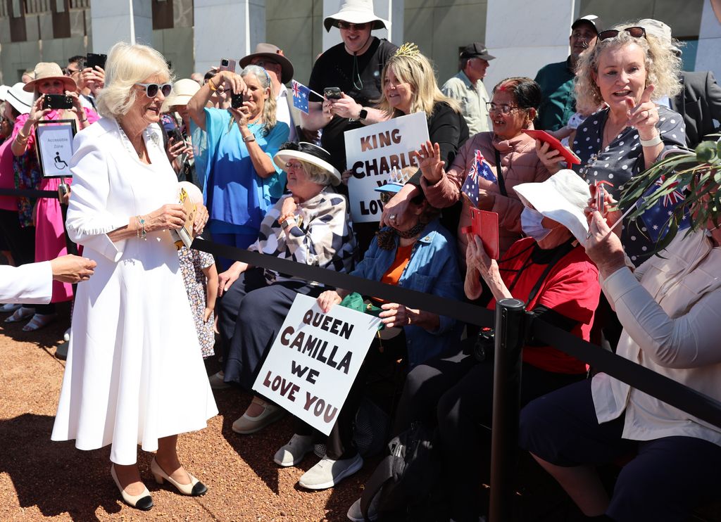 Queen Camilla greets public with Queen Camilla We Love You sign