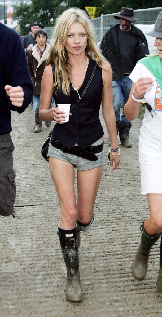 Kate Moss wearing grey micro shorts and Hunter wellies 