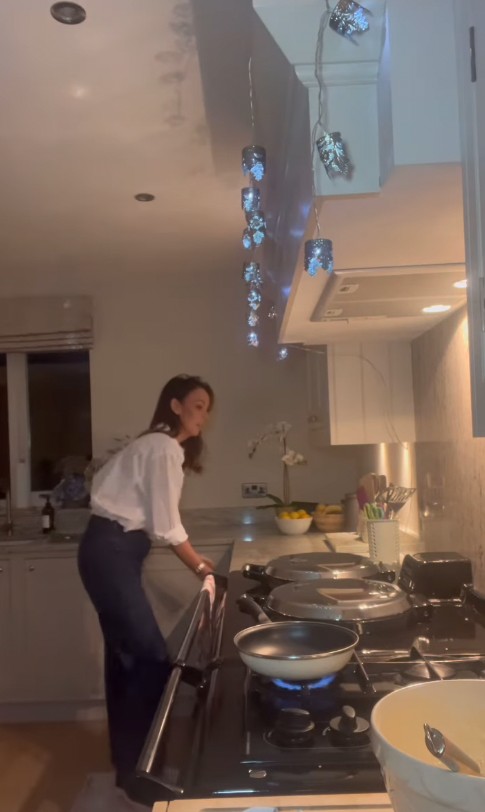 Woman in white shirt in kitchen