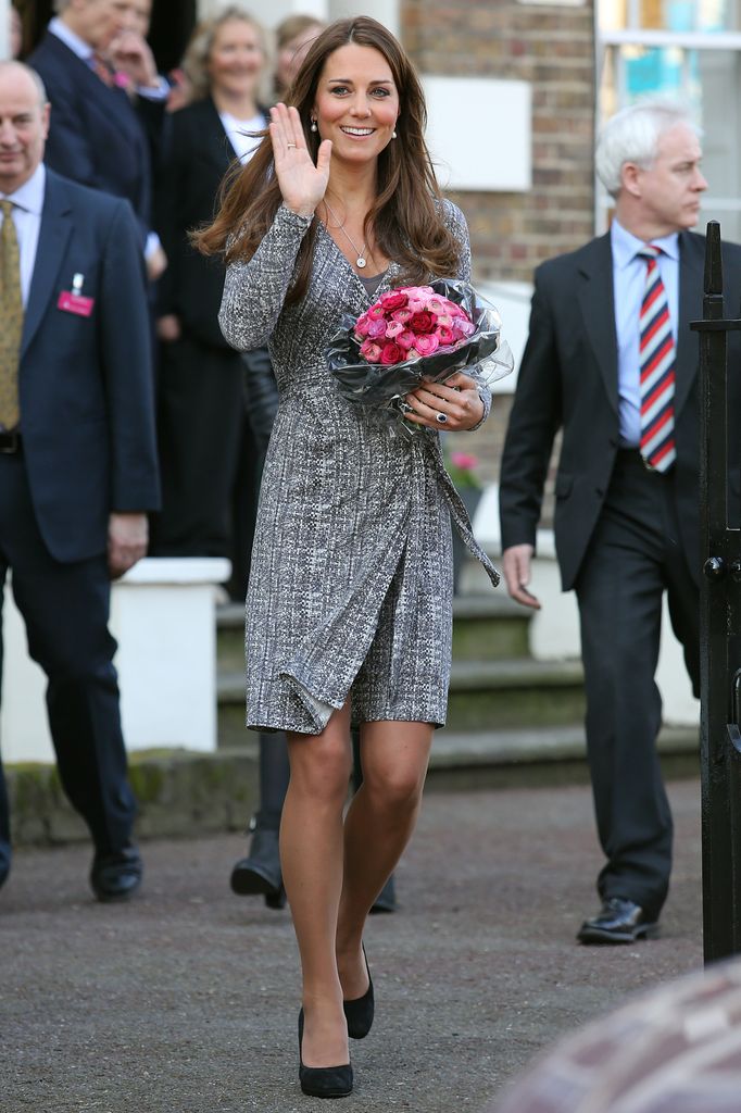 Catherine, Duchess of Cambridge waving in grey dress 