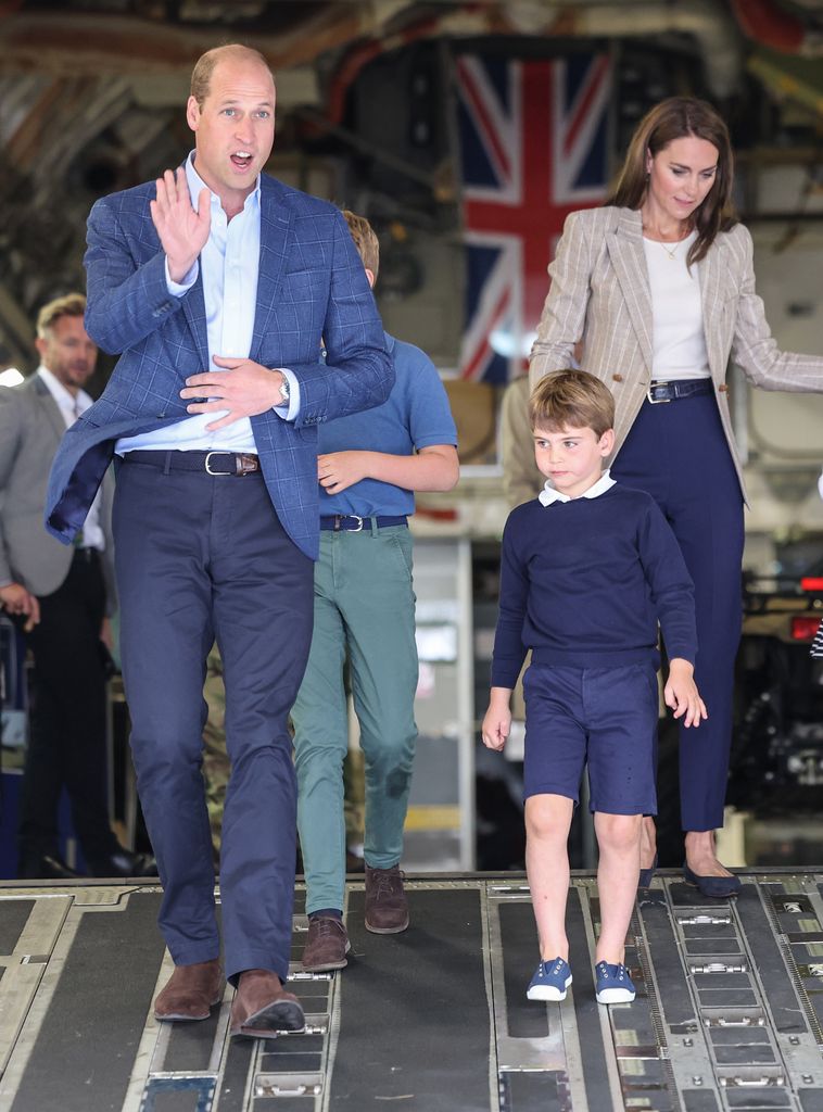 Prince Louis walks with his parents Prince William and Princess Kate
